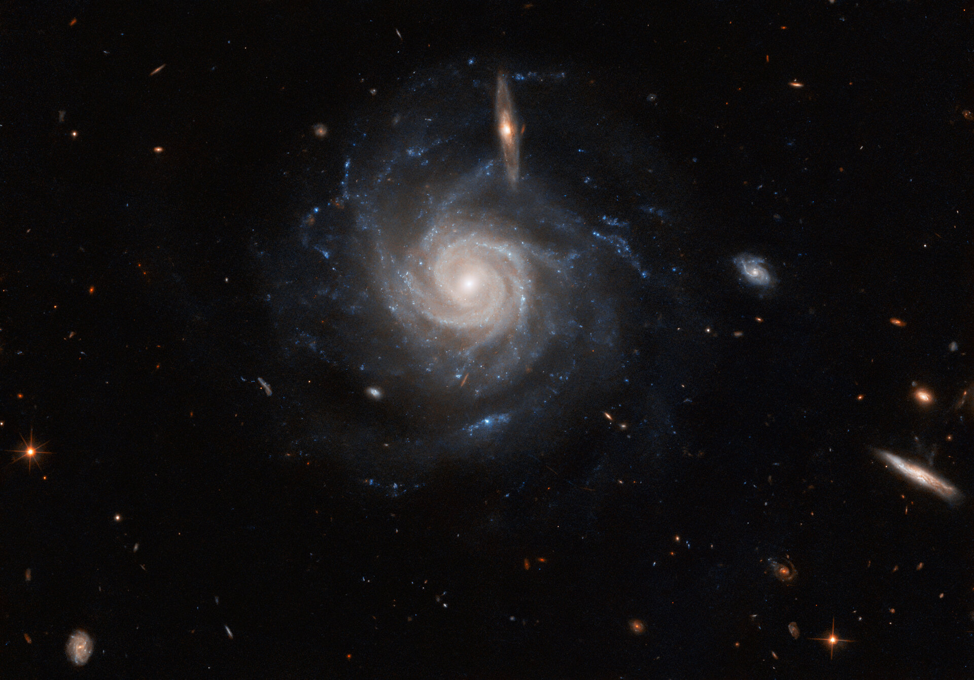 Hubble spotlights a swirling spiral pillars